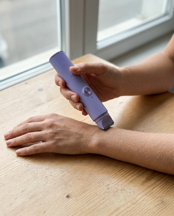 An adult demonstrating Softly on her own forearm